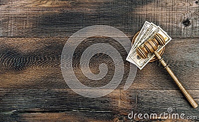 Auctioneer hammer US dollar banknotes wooden background. Judges gavel Stock Photo