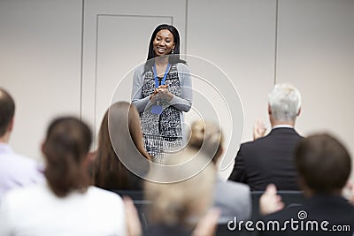 Audience Applauding Speaker After Conference Presentation Stock Photo