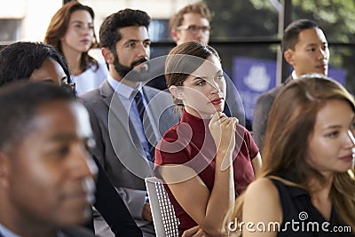 Audience at a business seminar listening to a speaker Stock Photo