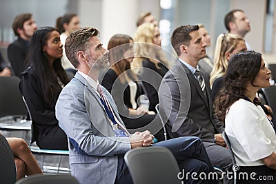 Audience Listening To Speaker At Conference Presentation Stock Photo