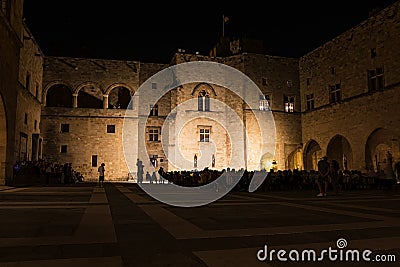 Audience of musical performance in Courtyard of Grand Master Palace in city of Rhodes Rhodes, Greece Stock Photo