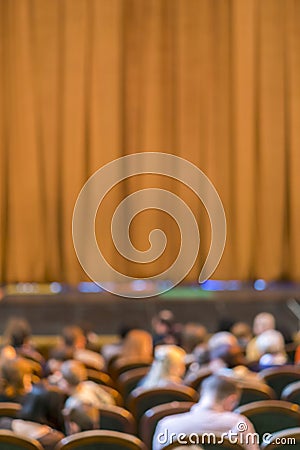 Audience in Theater. closed stage curtain in a theater. blurry. vertical photo Stock Photo