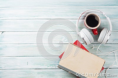 Audio book concept. Headphones, coffee and books Stock Photo