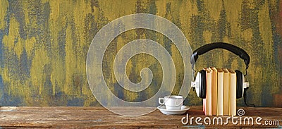 Audio book concept with row of books and vintage headphones, good copy space Stock Photo