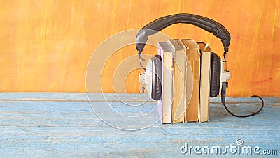 Audio book concept, with stack of books, headphones,good copy space Stock Photo