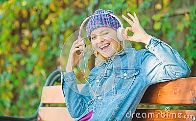 Audio book. style and music. hipster woman in headphones. relax in park with headphones. hipster girl with mp3 player Stock Photo