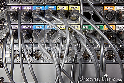 Audio cables plugged into a mixing hub Stock Photo