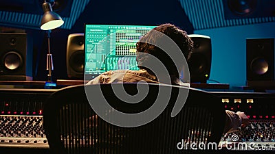Audio expert does mixing and mastering on tracks using digital editing software Stock Photo