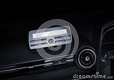 Audio multimedia player and radio on car console panel and emergency light button. Stock Photo