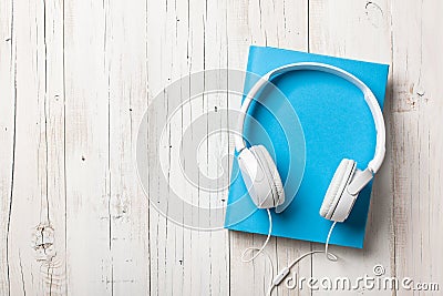 Audiobook concept with book and headphones Stock Photo