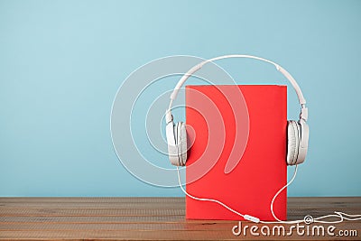 Audiobook concept with book and headphones Stock Photo