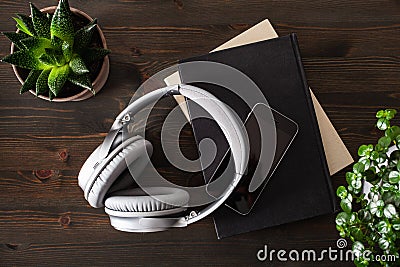 Audiobook concept modern wireless headphones smartphone book Stock Photo