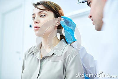 Audiologist Examining Woman Stock Photo