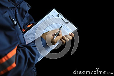 An auditor or inspector holds a clipboard and checklist of assessments Stock Photo