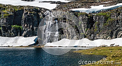 Auerlandsfjellet, Flotvatnet lake with waterfall Flotane. Stock Photo