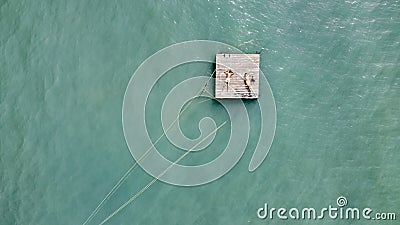 People on a lonely raft in the sea. castaway people need help. Editorial Stock Photo
