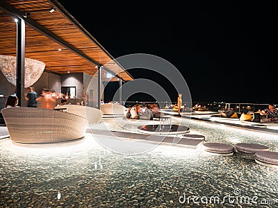 28 aug 20, Pattaya, Thailand. modern roof top sky bar. table over pool water. people enjoy moment. Editorial Stock Photo