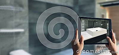 Augmented Reality bathroom planning. Sanitary ware. Hand holding digital tablet in real home background Stock Photo