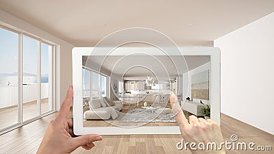 Augmented reality concept. Hand holding tablet with AR application used to simulate furniture and design products in empty Stock Photo