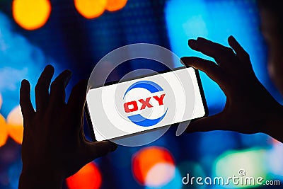 August 30, 2022, Brazil. In this photo illustration, the Occidental Petroleum OXY logo is displayed on a smartphone screen Cartoon Illustration