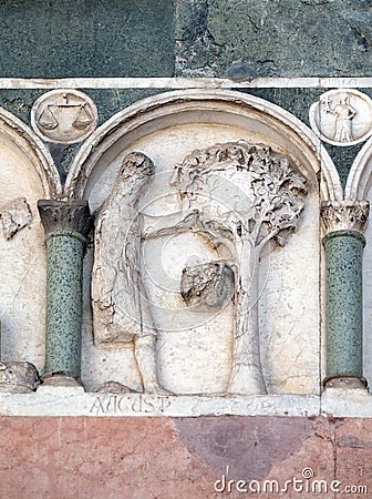 August, detail of the bass-relief representing the Labor of the months of the year, Cathedral in Lucca, Italy Stock Photo