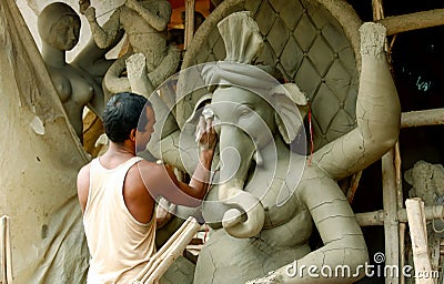 August 4, 2019, Kumartuli, Kolkata. A potter making sculpture of God Ganesha Editorial Stock Photo