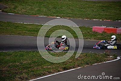 Kart racers compete for position in the overall standings Editorial Stock Photo