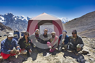 August 30, 2010 at 8:30 a.m. team of climbers and porters together with the first Muslim woman Ismaili from Pakistan climbs Editorial Stock Photo