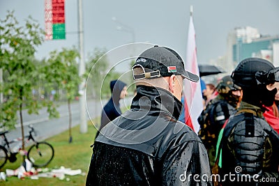 August 30 2020 Minsk Belarus A group of people wrapped in flags walk down the street Editorial Stock Photo