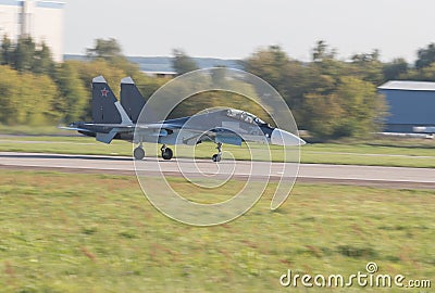 29 AUGUST 2019 MOSCOW, RUSSIA: Reactive fighter jet is gaining speed on the runway Editorial Stock Photo