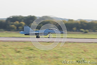 29 AUGUST 2019 MOSCOW, RUSSIA: Reactive fighter jet is gaining speed on the runway before to take off Editorial Stock Photo