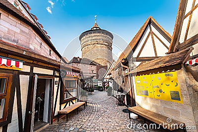 Handwerkerhof medieval shopping area and Koenigstor Tower Editorial Stock Photo