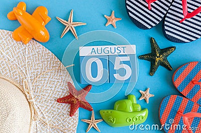 August 5th. Image of August 5 calendar with summer beach accessories and traveler outfit on background. Summer day Stock Photo