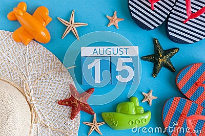 August 15th. Image of August 15 calendar with summer beach accessories and traveler outfit on background. Summer day Stock Photo