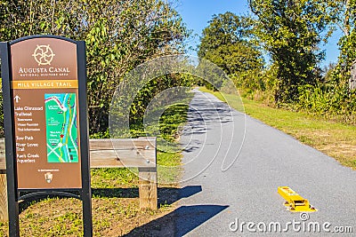 Augusta Canal Trailhead paved walking trail and sign Editorial Stock Photo