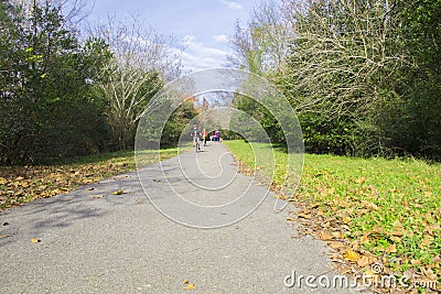 Augusta Canal Trail people riding bikes dressed in holiday apparel Editorial Stock Photo