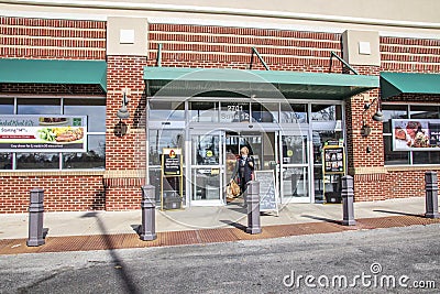 The Fresh Market retail grocery store entrance senior wearing a face mask Editorial Stock Photo