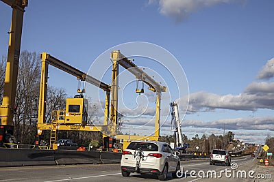 Huge Heavy industrial road machines and cranes on a bridge construction site right copy space Editorial Stock Photo