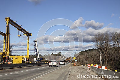 Huge Heavy industrial road machines and cranes on a bridge construction site top copyspcae traffic Editorial Stock Photo