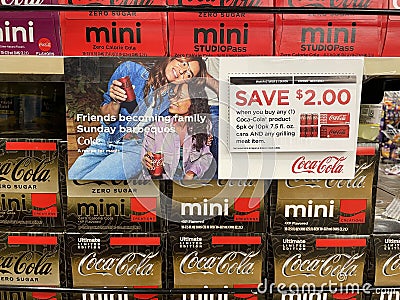 IGA Grocery store coca cola mini packs and coupon on shelf Editorial Stock Photo
