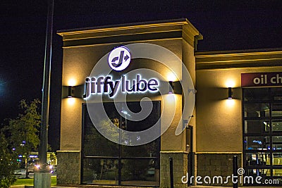 Jiffy Lube at night sign and building Editorial Stock Photo