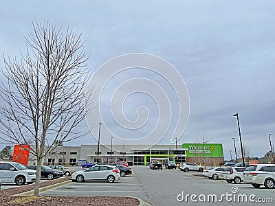 Walmart Neighborhood supermarket grocery retail store and parking lot distant view Editorial Stock Photo