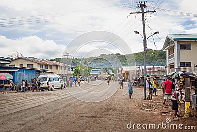 Busy main street in the town of Auki, the capital of Malaita Province in the Solomon Islands. Editorial Stock Photo
