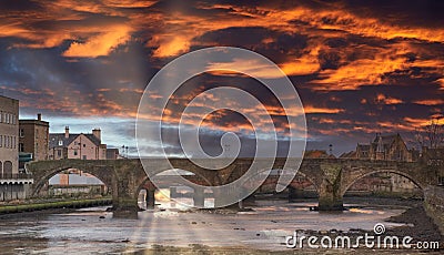 The Auld Old Brigg in Ayr in Scotland Dramatic Sunset over the Burn`s Town Stock Photo