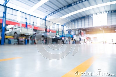 Auomobile repair, Car repair station paved with epoxy floor And a picture of an electric lift for a car that comes to change the Stock Photo