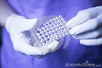 Auriculartherapy ear seed treatment Stock Photo