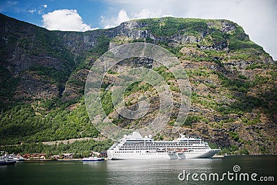 cruise liner and boats near majestic mountains at Aurlandsfjord Flam (Aurlandsfjorden) Norway Editorial Stock Photo