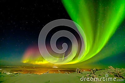 Aurora borealis also known like northern or polar lights beyond the Arctic Circle in winter Lapland Stock Photo