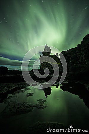 Aurora Borealis (Northern Lights) above londrangar rock formation Stock Photo