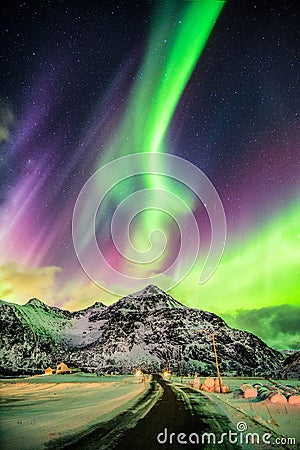 Aurora Borealis (Northern lights) explosion over mountains and r Stock Photo